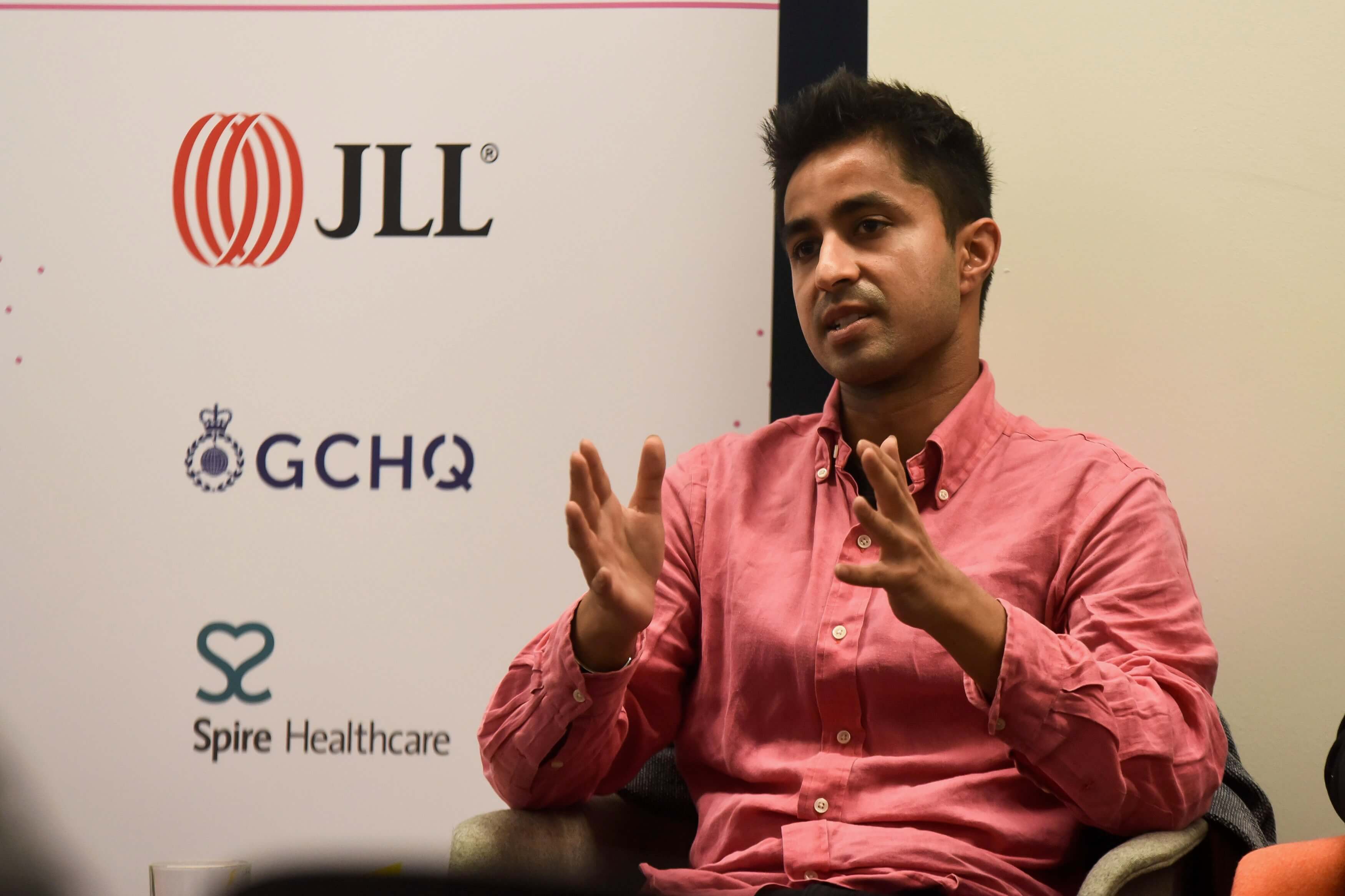 Mayur speaking at an industry event featuring JLL and GCHQ